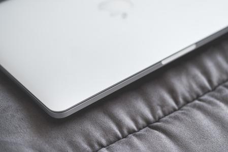 Closed Macbook Laptop on a Sofa #2